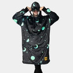 Someone modeling the Hideout Hoodie Galactic Glow Wearable Blanket Hoodie has the hood up and built-in mask pulled down.