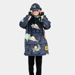 A child pulls on the eye mask built into the hood of the Kids Hideout Hoodie.