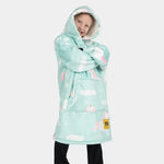 A child crosses their arms and smiles while modeling the Unicorn Kids Hideout Hoodie.