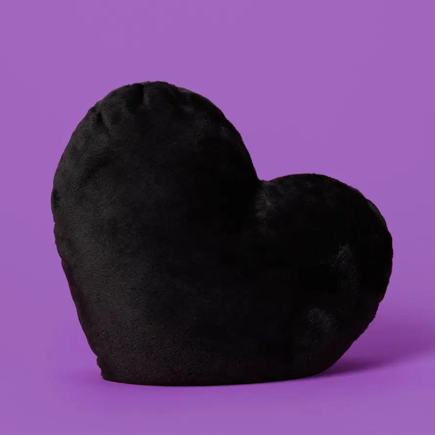 The black Heart to Hug 5 lb Weighted Pillow with a purple background.
