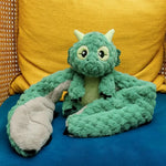 Zephyr the Dragon Hugaround on a yellow and blue chair.