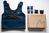 A display of the vest, the individual weights, and the product box of the Weighted Compression Vest.