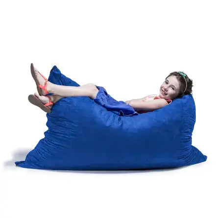 A child lies on the Jaxx 3.5 Saxx Kids Bean Bag.