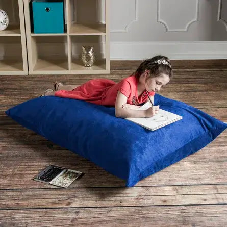 A child lies down on the Jaxx 3.5 ft Saxx Kids Bean Bag.