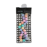 The pastel Princess and the Pea Necklace in its product packaging.