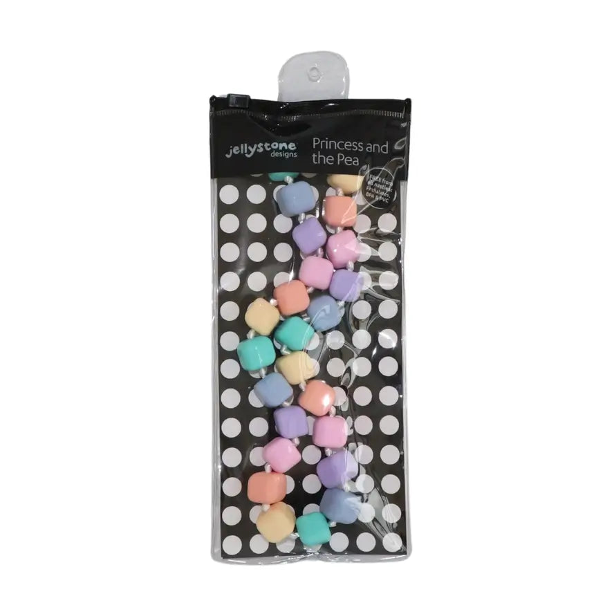 The pastel Princess and the Pea Necklace in its product packaging.