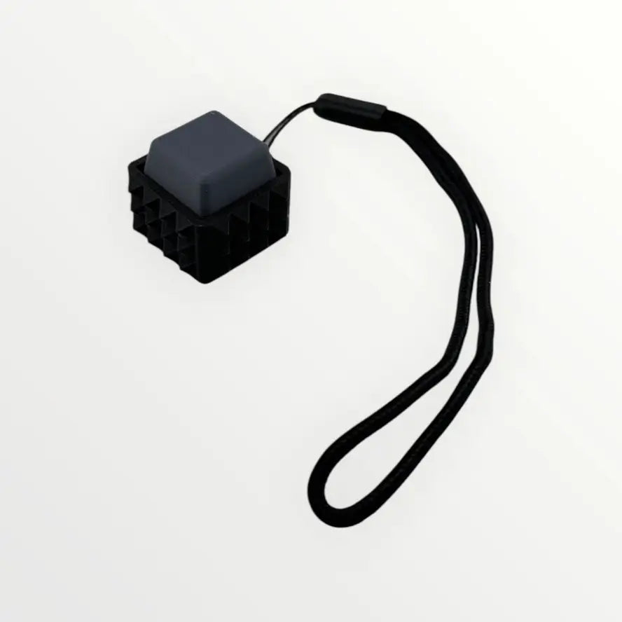 The gray Spiky Mechanical Keyboard Fidget - Clicky.