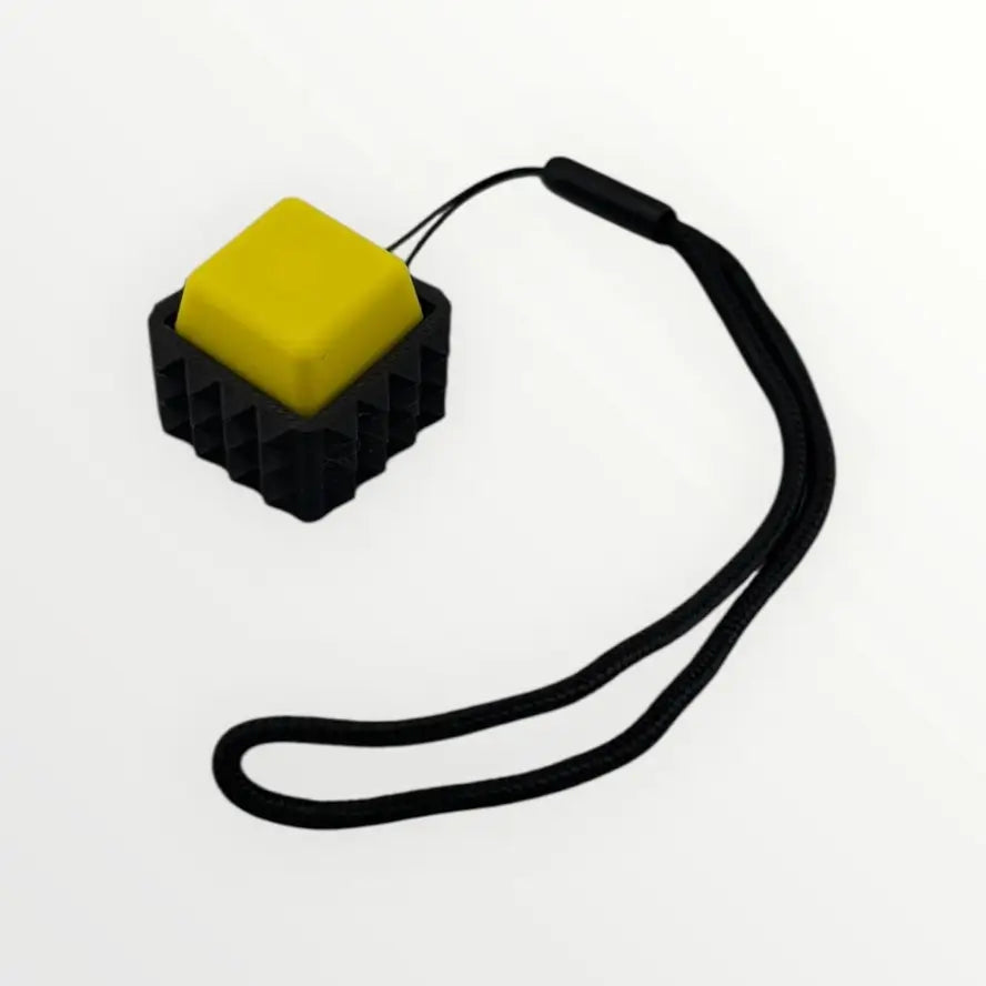 The yellow Spiky Mechanical Keyboard Fidget - Clicky.