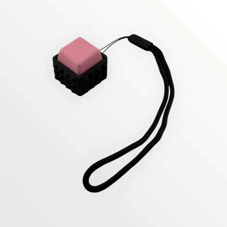 The pink Kahn Creations Spiky Mechanical Keyboard Fidget Keychain - Clicky.