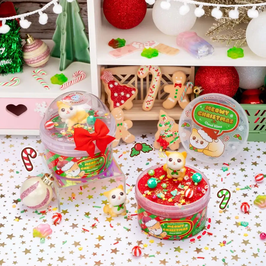 Two of the Meowy Christmas Cloud Slimes sits among bright and colorful holiday decorations.