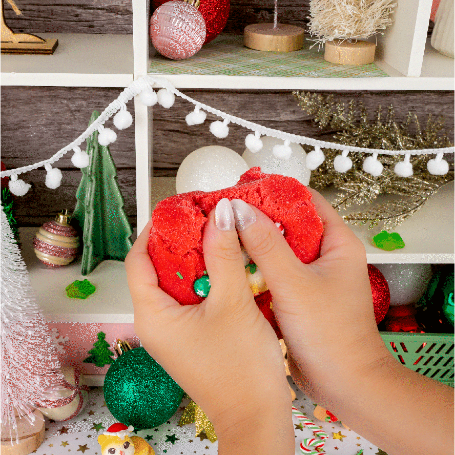 An animated GIF of a hand stretching the red cloud slime.