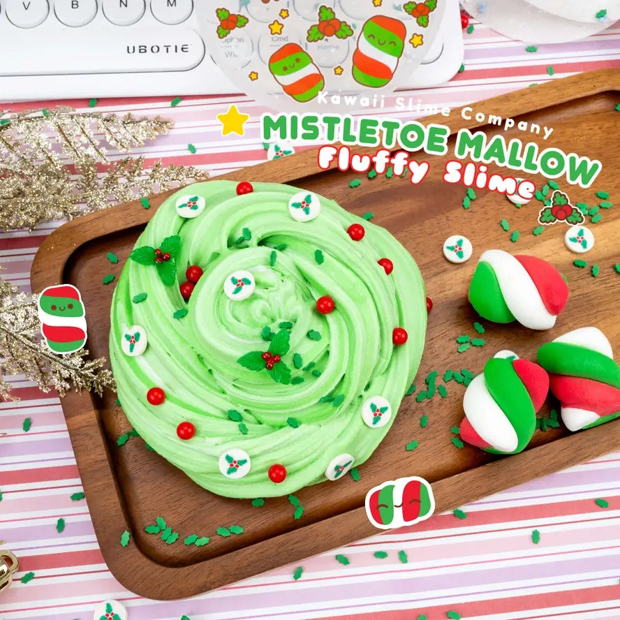 The Mistletoe Mallow Fluffy Slime stretched into a neat pile, sitting next to the holiday marshmallows that come with.