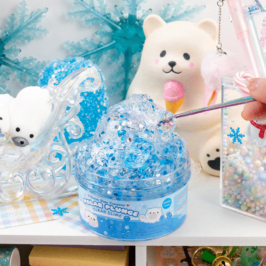 An animated GIF of a spoon being stuck into the clear slime and stretching it.