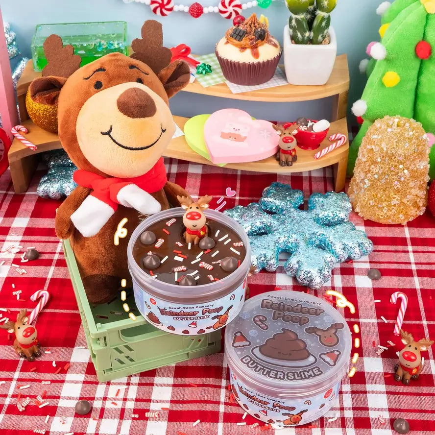 An open jar of the Reindeer Poop Butter Slime sits next to another one with a lid on it.