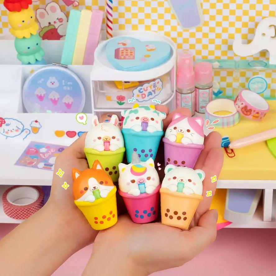 A hand holds up a variety of the six different Tapioca Tots.