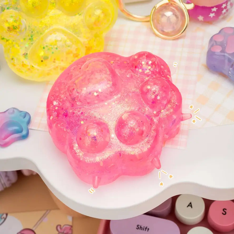 The pink Gummy Kitty Paw Squish.