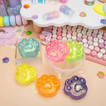 The assortment of Gummy Kitty Law Squishes in a colorful scene.