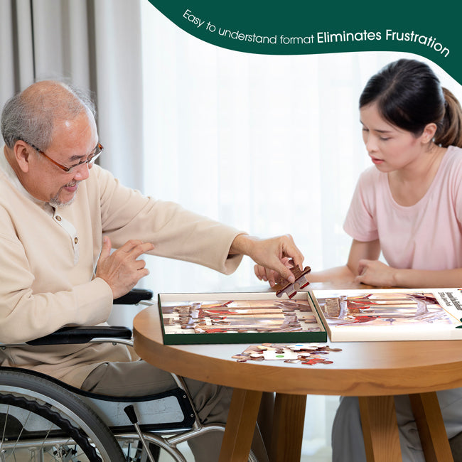 A man in a wheelchair sorts puzzle pieces at a table.