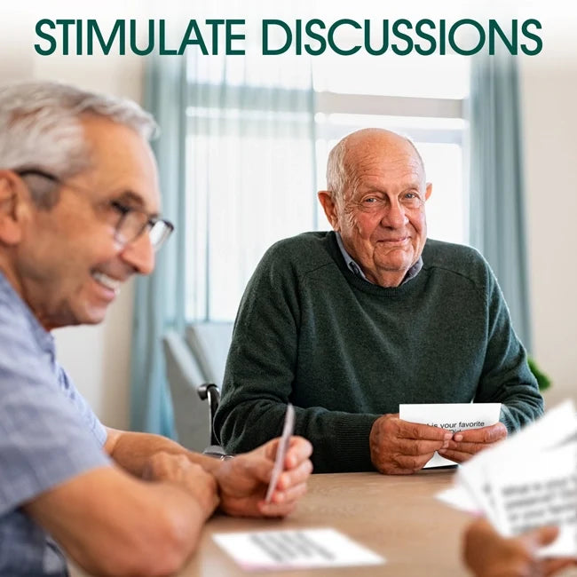 Several men sit around a table holding Let's Chat Conversation Cards, with text that reads: stimulate discussions.