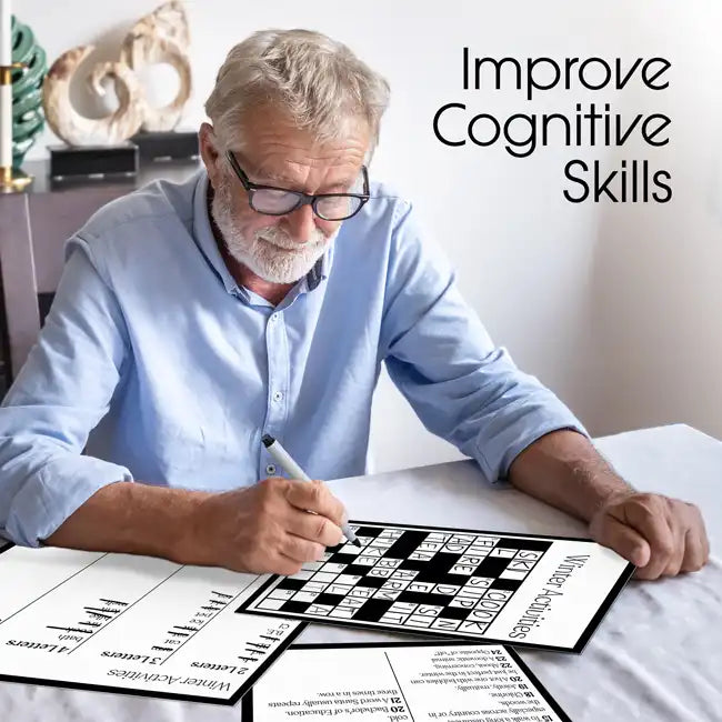 A senior sits at a table with most of a crossword puzzle filled out.