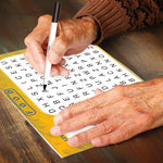 The Word Search Puzzle for Seniors with two hands for scale.