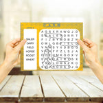 Two hands hold up a Word Search Puzzle for Seniors.