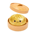 The golden glittery  Lucky Bao Mystery Squishy Dumpling.