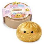 The golden glittery Lucky Bao Mystery Squishy Dumpling.