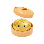 The glittery gold collectible Mini Lucky Bao Mystery Dumpling.