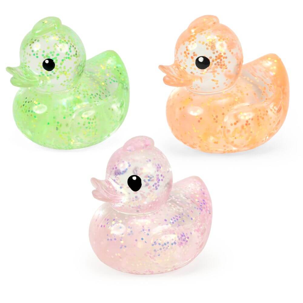 Three colors of the glittery Stretchy Glow Ducks.