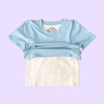 The Light Blue  Kids Compression Lined Sensory T-shirt, with the t-shirt portion raised to reveal the compression undershirt.