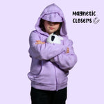 A child holds a stuffie with the hood up on the Kids QuietSense™ Sound Reducing Sensory Hoodie in Lilac.