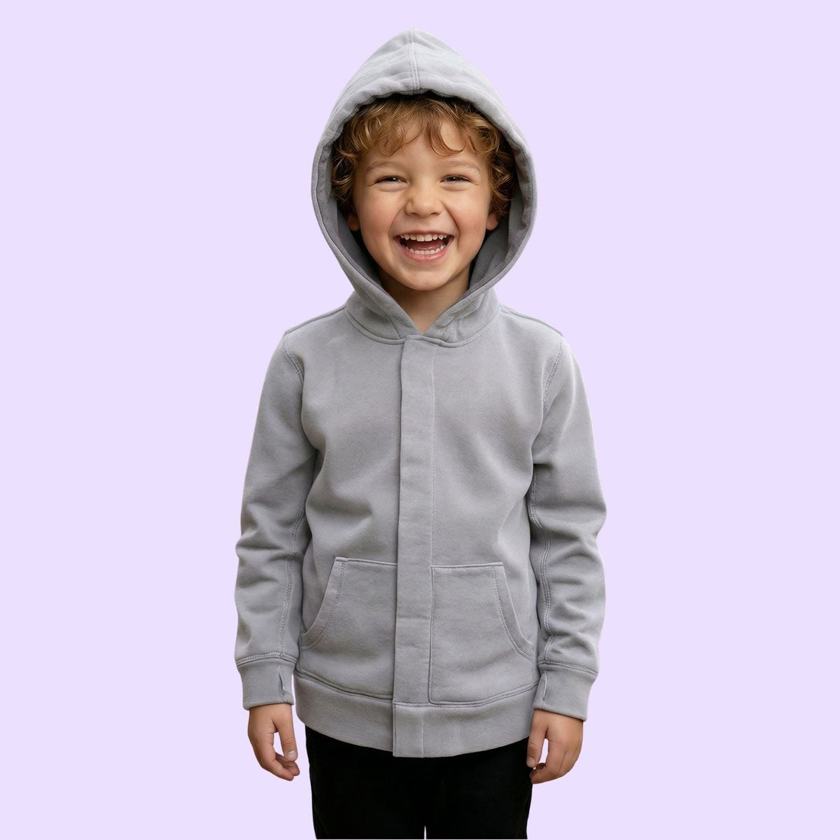 A child smiles with the hood up on their Grey Kids QuietSense™ Sound Reducing Sensory Hoodie.