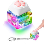 A Kitty Paw LED Fidget Keyboard Clicker Keychain lights up in rainbow colors. 