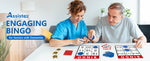 An older gentleman and a nurse assess two separate bingo cards.