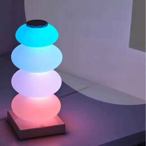 The LED Spherical Touch Sensitive Desk Lamp in an ombre blue to red color combination.