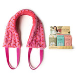 The Hot Pink Lemon Lavender Hot Stuff Heated Neck Wrap next to the display box.