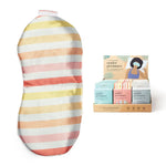 The Cabana Stripe Under Pressure Weighted Eye Mask next to the display box of three color variants.