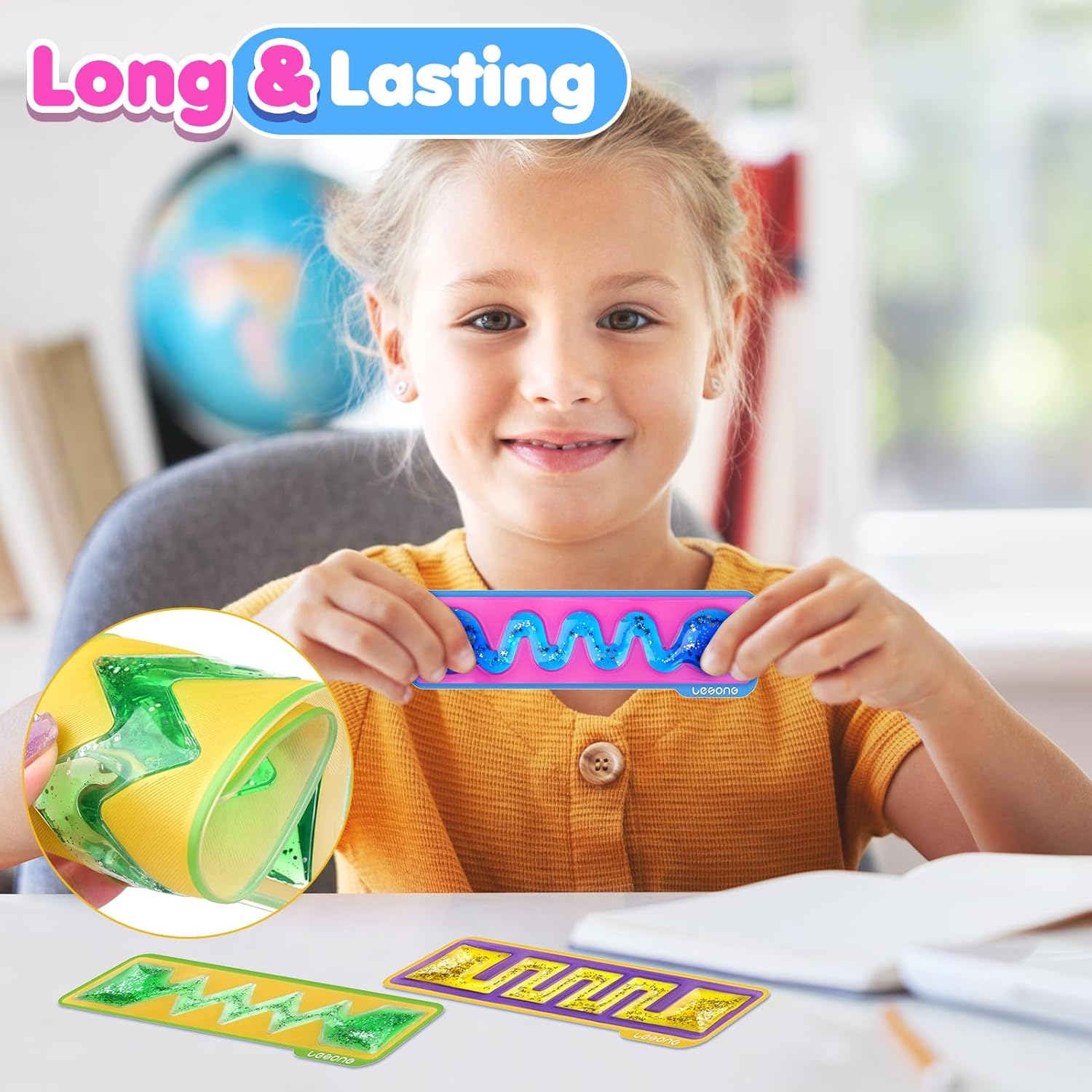 A child holds up the pink and blue Squishy Sensory Toy.