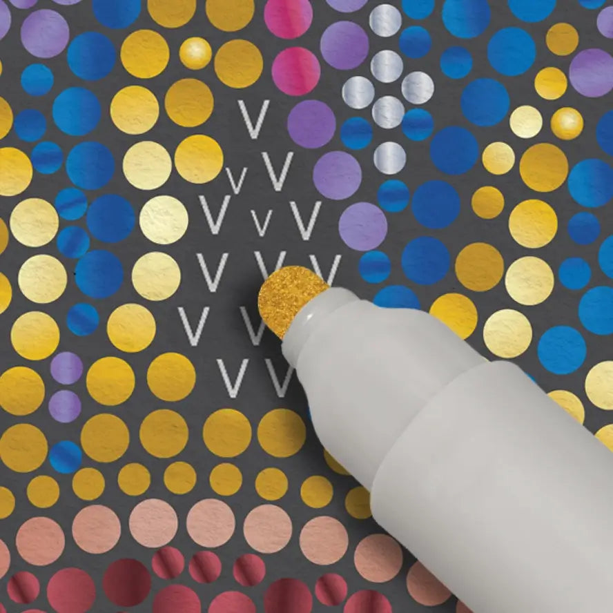 A gold marker fills in the letter V on a FlowArt Dot-by-Marker scene.