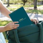 Two hands put the Dot-by-Letter Sweater Weather pad into a similarly colored bag.