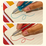 A hand writes with both the blue Fresh Scented Lava Pen and the red Spicy Scented Lava Pen.