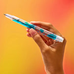 A hand tilts back the blue Scented Lava Pen to watch the lava move.