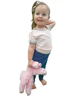 A child wears the Light Pink Kozie Medical and G-Tube One-Piece Bodysuit - The Susie with a pair of pants.