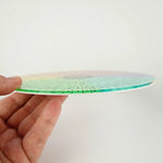 The 7" Rigid Acrylic Disk Emotion Sensation Wheel sideways, so you can see the thickness of the disk.