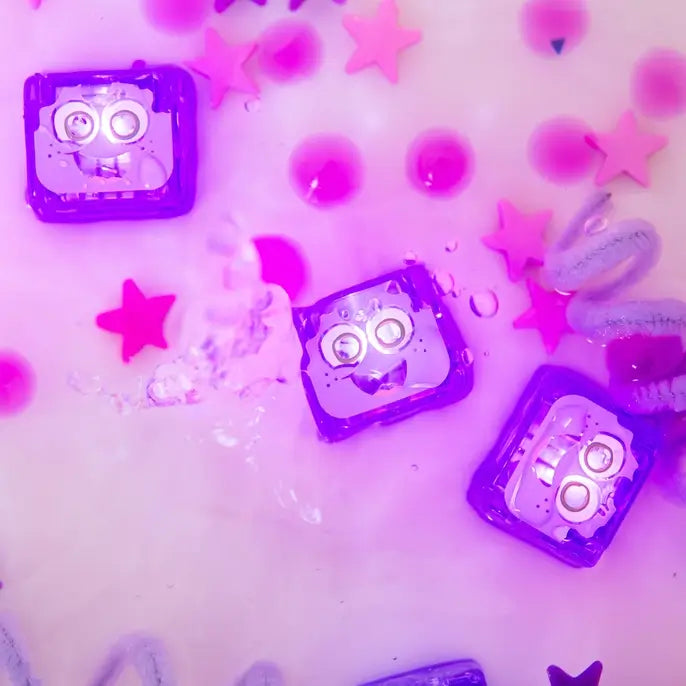 The Lumi Glo Pals Light-Up Cubes lit up in water.