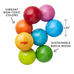 An infographic showing features of the Magica Wooden Grasping and Teething Toy by HABA.