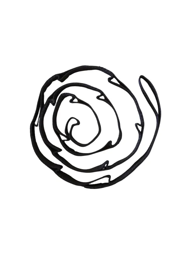 The Marlowe Extra Long Daisy Chain wrapped in a loose coil.