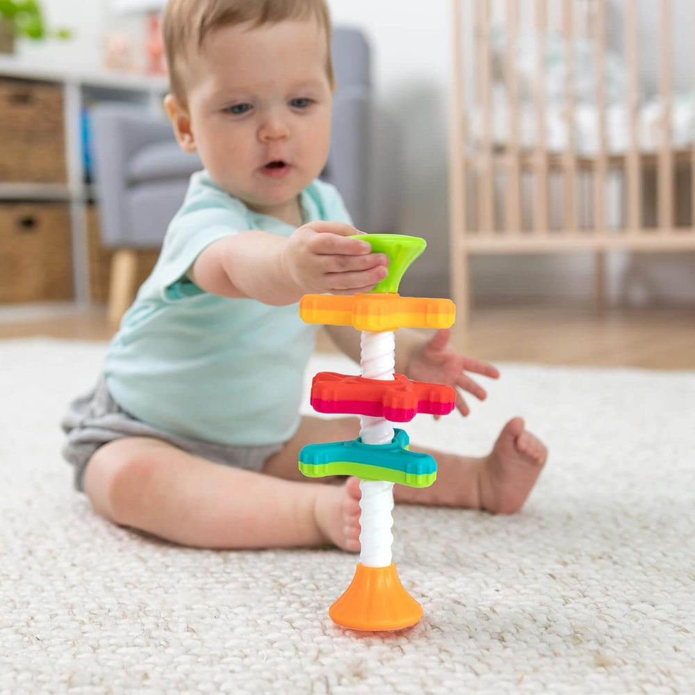 A baby balances the MiniSpinny.