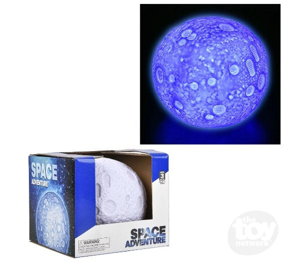 Two pictures that show the product package for the Color Changing Moonlight, and the Color Changing Moon Light lit up in a dark area.